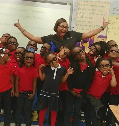 Dr. Kidd in a classroom with children