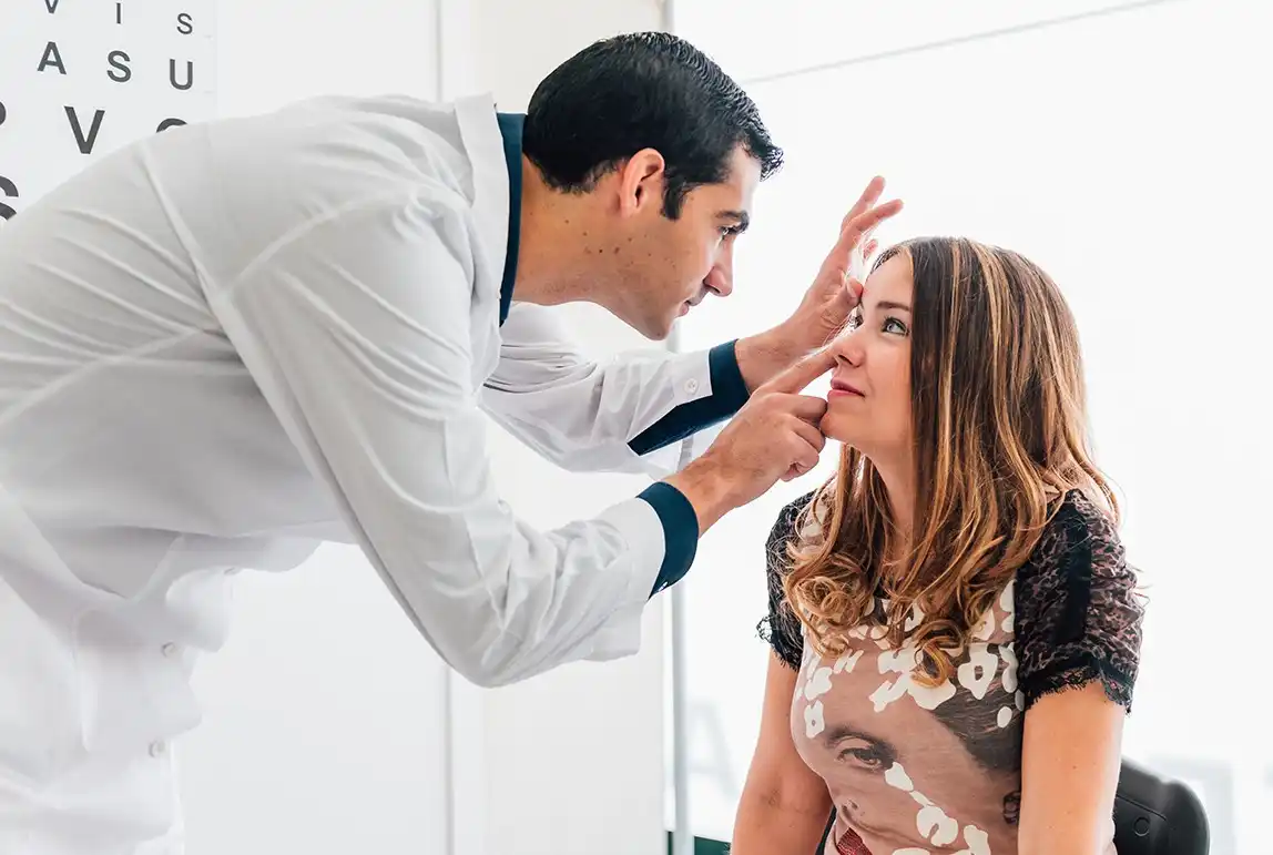 doctor examining his patient's eyes